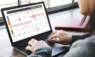 woman scheduling social media posts on computer