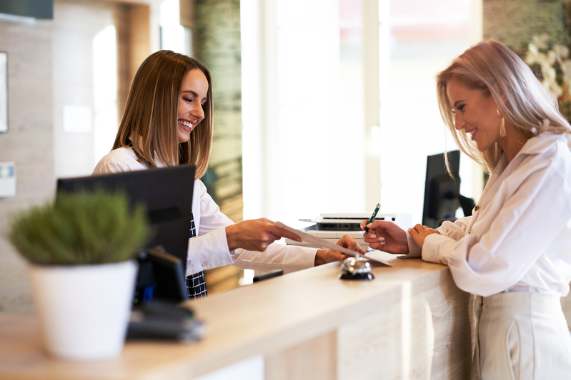 woman checking in to hotel