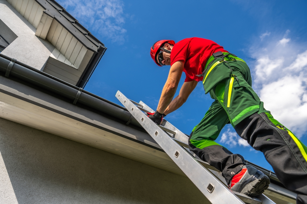 man working on gutter services