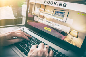 person booking a hotel on their laptop